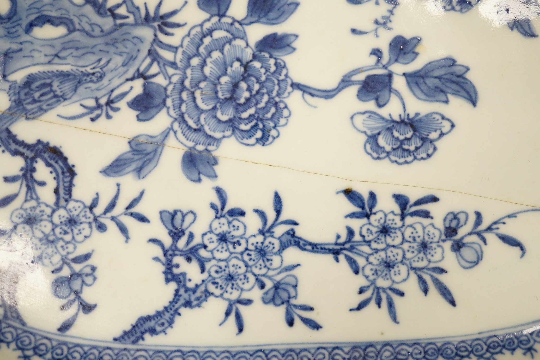 Three 18th century Chinese blue and white meat plates, largest, 41.5cm wide, 35cm deep (a.f.)